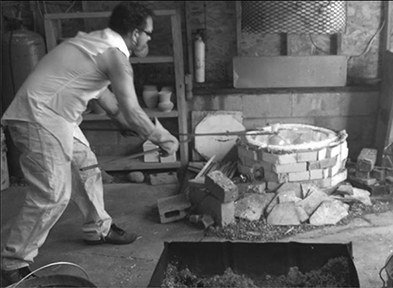 Jack removing pots from the raku kiln